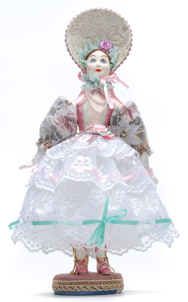 Girl in a Summer Dress and Hat Porcelain Doll on a Stand - 10 Inches