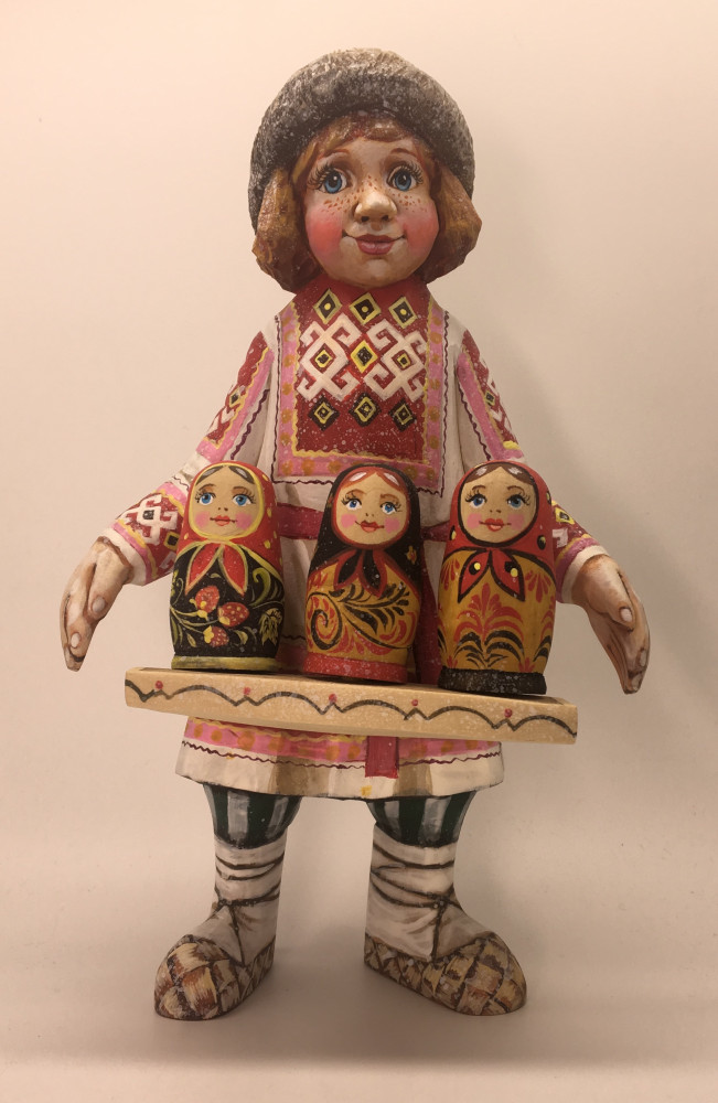 22cm Russian Boy in a Winter Fur Hat with Matryoshka dolls hand painted by Karpova Nadezda