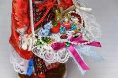 The Haberdasher in a Summer Dress and Hat Porcelain Doll on a Stand - 10 Inches