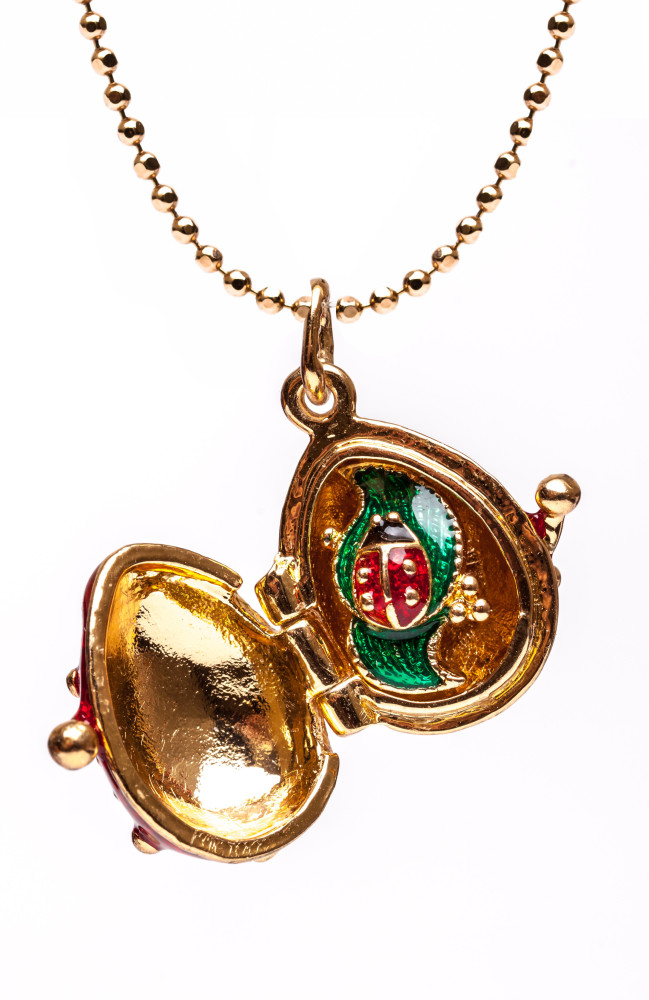 Tree Opening Red Egg Pendant
